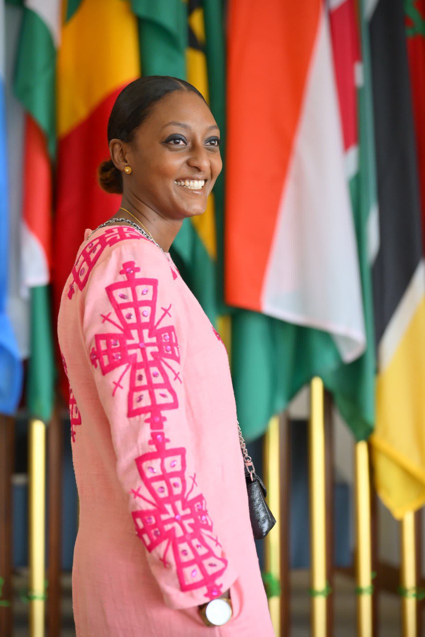 Radiant Elegance: Modern Pink Ethiopian Dress with Intricate Embroidery and Shiny Stone Accents