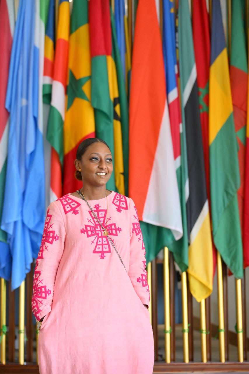 Radiant Elegance: Modern Pink Ethiopian Dress with Intricate Embroidery and Shiny Stone Accents