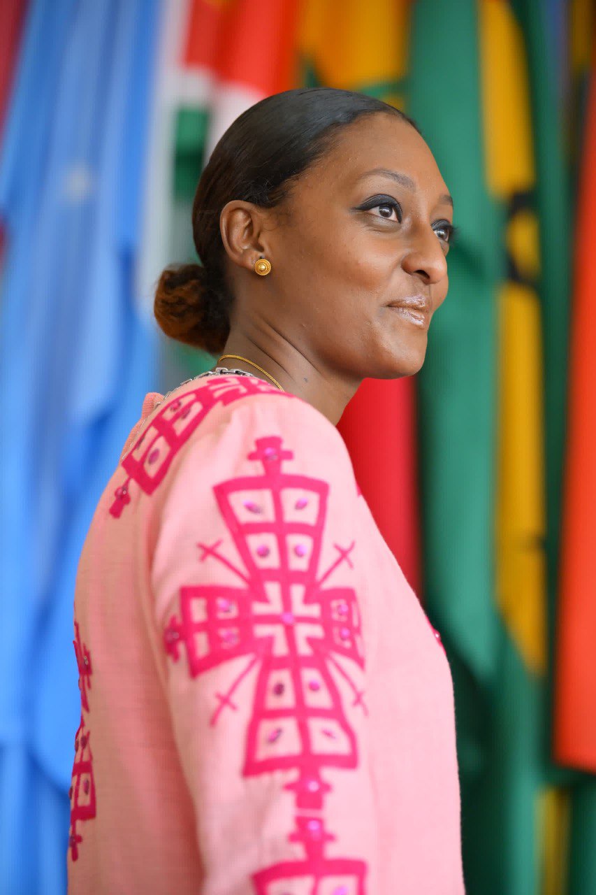 Radiant Elegance: Modern Pink Ethiopian Dress with Intricate Embroidery and Shiny Stone Accents