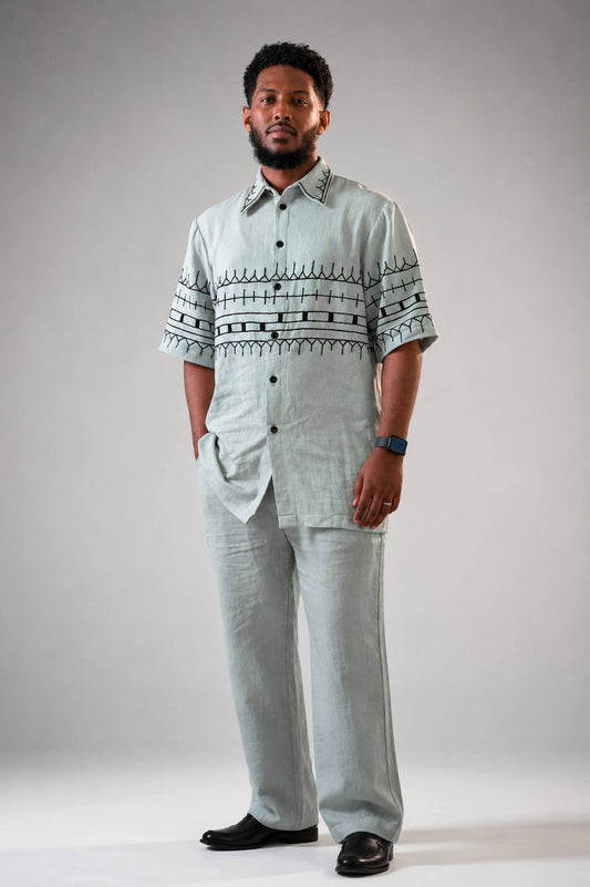 Ethiopian Elegance: Light Blue Habesha Shirt and Trouser Set with Black Embroidery